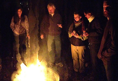 lit firepit at night in the yard